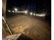Backyard at night with string lights illuminating the area at 135 Tuscany Trce, Dallas, GA 30157