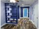 Finished basement with built-in shelving unit at 135 Tuscany Trce, Dallas, GA 30157