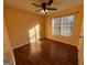 Simple bedroom with hardwood floors and a window with blinds at 135 Tuscany Trce, Dallas, GA 30157