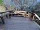 Wooden deck with bench and small table at 135 Tuscany Trce, Dallas, GA 30157