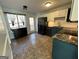 Modern kitchen with dark blue cabinets, granite countertops, and stainless steel appliances at 135 Tuscany Trce, Dallas, GA 30157