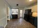 Modern kitchen with dark blue cabinets, granite countertops, and stainless steel appliances at 135 Tuscany Trce, Dallas, GA 30157