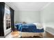 Simple bedroom with large window and dark curtains at 985 Buckhorn Bnd, Locust Grove, GA 30248