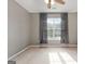 Bright bedroom with ceiling fan and window at 985 Buckhorn Bnd, Locust Grove, GA 30248