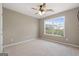 Spacious bedroom with ceiling fan and large window at 985 Buckhorn Bnd, Locust Grove, GA 30248