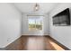 Spacious bedroom with hardwood floors and large window at 985 Buckhorn Bnd, Locust Grove, GA 30248