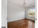 Bright bedroom with hardwood floors and large window at 985 Buckhorn Bnd, Locust Grove, GA 30248