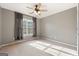 Bedroom with ceiling fan and large window at 985 Buckhorn Bnd, Locust Grove, GA 30248