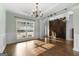 Spacious dining room featuring hardwood floors and barn door at 985 Buckhorn Bnd, Locust Grove, GA 30248