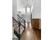 Bright entryway with hardwood floors and staircase at 985 Buckhorn Bnd, Locust Grove, GA 30248