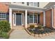Front entrance with brick columns and a dark door at 985 Buckhorn Bnd, Locust Grove, GA 30248