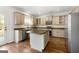 Modern kitchen with stainless steel appliances and island at 985 Buckhorn Bnd, Locust Grove, GA 30248