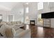 Spacious living room with hardwood floors and cozy fireplace at 985 Buckhorn Bnd, Locust Grove, GA 30248