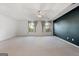 Spacious main bedroom with neutral carpeting, two windows, and a ceiling fan at 985 Buckhorn Bnd, Locust Grove, GA 30248