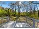 View from the back deck showing the surrounding woods and sunlight at 633 Westbridge Rd, Fayetteville, GA 30214