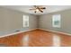 Bedroom featuring neutral walls, laminate floors, and plenty of natural light at 633 Westbridge Rd, Fayetteville, GA 30214