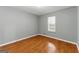 Bedroom with neutral paint, window and laminate floors at 633 Westbridge Rd, Fayetteville, GA 30214