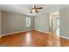 Spacious bedroom with neutral paint, ceiling fan, and laminate floors at 633 Westbridge Rd, Fayetteville, GA 30214