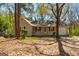 Charming ranch-style home featuring a cozy front porch and a one-car garage at 633 Westbridge Rd, Fayetteville, GA 30214