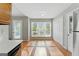 Bright eat-in kitchen featuring laminate floors, access to backyard, and closet at 633 Westbridge Rd, Fayetteville, GA 30214