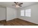 Bedroom with wood floors, ceiling fan, and double windows at 1901 Grant Sw Rd, Atlanta, GA 30331