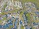 Aerial view of townhouses, parking, and a pool at 6036 Regent Mnr, Lithonia, GA 30058