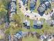 Aerial view of condo complex, highlighting its location within the neighborhood at 6036 Regent Mnr, Lithonia, GA 30058