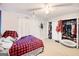 Bedroom with double bed, closet, and ceiling fan at 6036 Regent Mnr, Lithonia, GA 30058