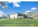 Tan colored siding condo building with private fenced yard at 6036 Regent Mnr, Lithonia, GA 30058