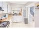 Small kitchen with white cabinets and a double sink at 6036 Regent Mnr, Lithonia, GA 30058