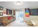 Living room with couches and sliding glass door to patio at 6036 Regent Mnr, Lithonia, GA 30058