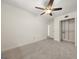 Empty bedroom with a large closet and ceiling fan at 6667 Ridge Moore Dr, Peachtree Corners, GA 30360