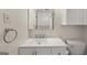 Clean bathroom with a white cabinet, toilet, and a towel ring at 6667 Ridge Moore Dr, Peachtree Corners, GA 30360