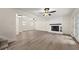 Spacious living room with new flooring and a fireplace at 6667 Ridge Moore Dr, Peachtree Corners, GA 30360