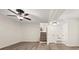Finished basement area with neutral paint, carpet, ceiling fan, and closet at 6667 Ridge Moore Dr, Peachtree Corners, GA 30360