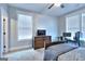 Bedroom featuring a bed, dresser, and workspace with two monitors at 1080 Gaithers Rd, Mansfield, GA 30055