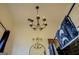 Chic bathroom with black tile, chandelier, and mirror at 2173 Anderson Se Ave, Covington, GA 30014