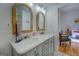 Bathroom with double vanity, marble countertops, and mosaic tile floor at 2173 Anderson Se Ave, Covington, GA 30014