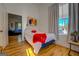 Simple bedroom with a full bed and view of the living room at 2173 Anderson Se Ave, Covington, GA 30014