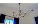 Elegant chandelier with five lights, adds a touch of sophistication to any room at 2173 Anderson Se Ave, Covington, GA 30014