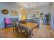 Bright dining area with farmhouse table and view into the kitchen at 2173 Anderson Se Ave, Covington, GA 30014