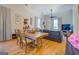 Farmhouse-style dining room with wooden table and view into living room at 2173 Anderson Se Ave, Covington, GA 30014