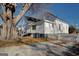 Side view of a white house with a large tree and a white picket fence at 2173 Anderson Se Ave, Covington, GA 30014