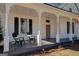 Relaxing front porch with two adirondack chairs at 2173 Anderson Se Ave, Covington, GA 30014