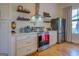 Modern kitchen with stainless steel appliances and white shaker cabinets at 2173 Anderson Se Ave, Covington, GA 30014