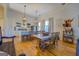 Modern kitchen with white cabinets, island, and hardwood floors at 2173 Anderson Se Ave, Covington, GA 30014