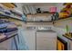 Convenient laundry room with washer, dryer, and shelving at 2173 Anderson Se Ave, Covington, GA 30014