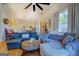 Open concept living room and kitchen with hardwood floors and comfortable seating at 2173 Anderson Se Ave, Covington, GA 30014