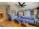 Living room with hardwood floors, sofa, and kitchenette at 2173 Anderson Se Ave, Covington, GA 30014