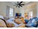 Open living area featuring hardwood floors, sectional sofa, and ceiling fan at 2173 Anderson Se Ave, Covington, GA 30014
